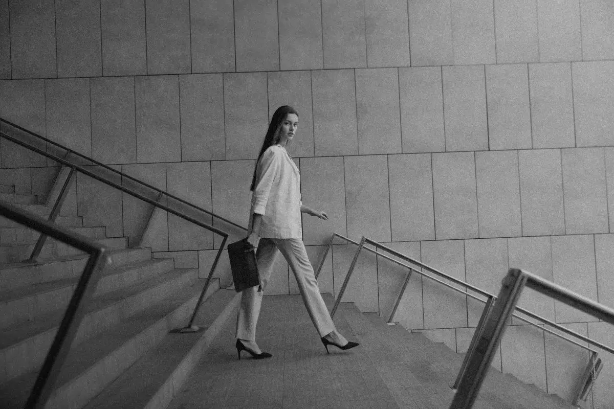 A woman walking in a clinic setting promoting skin health at Brandish Clinic Facial and Skin Rejuvenation in La Jolla, CA.